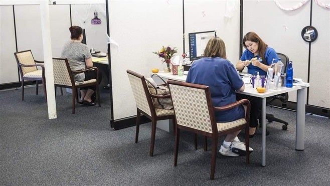 People sign up for health insurance through the Covered California exchange in Huntington Beach. President-elect Donald Trump wants to allow insurance companies to sell policies across state lines, but critics fear the plan would lead to higher premiums.