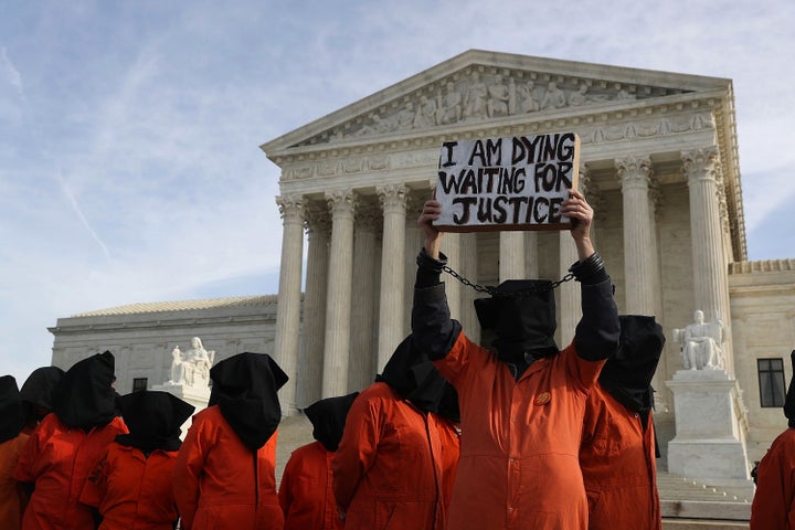 Protesters gather in front of the U.S. Supreme Court to mark 15 years since the first prisoners were brought to the U.S. detention facility in Guantanamo Bay, Cuba, on Jan. 11, 2017.