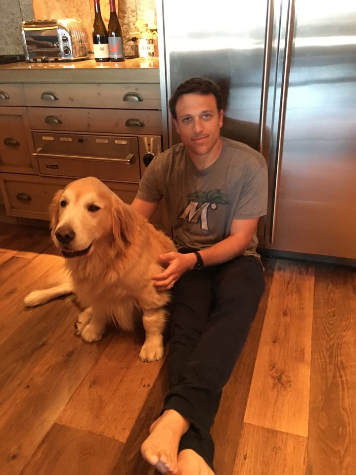 Finn and the author before the golden retriever passed away. Notice the "Finn pose" once again.