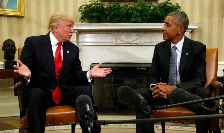 President Barack Obama listens to President-elect Donald Trump in the White House Oval Office on Nov. 10, 2016.