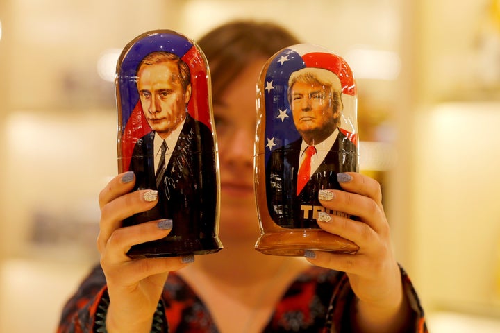 Painted Matryoshka dolls, also known as Russian nesting dolls, bearing the faces of Trump, right, and Russian President