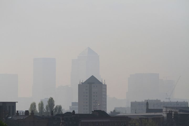 A view of Canary Wharf has become almost invisible showing high pollution level seen from Hackney, London