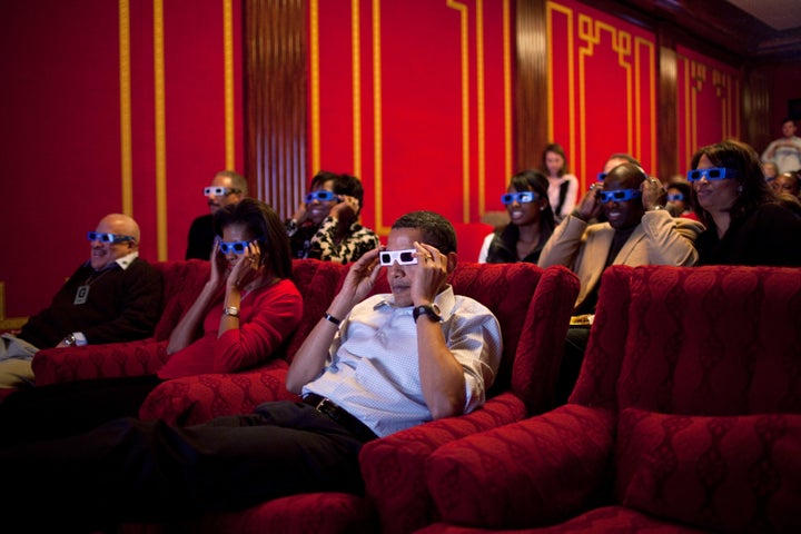 The Obamas wearing 3-D glasses in the family theater of the White House in 2009.