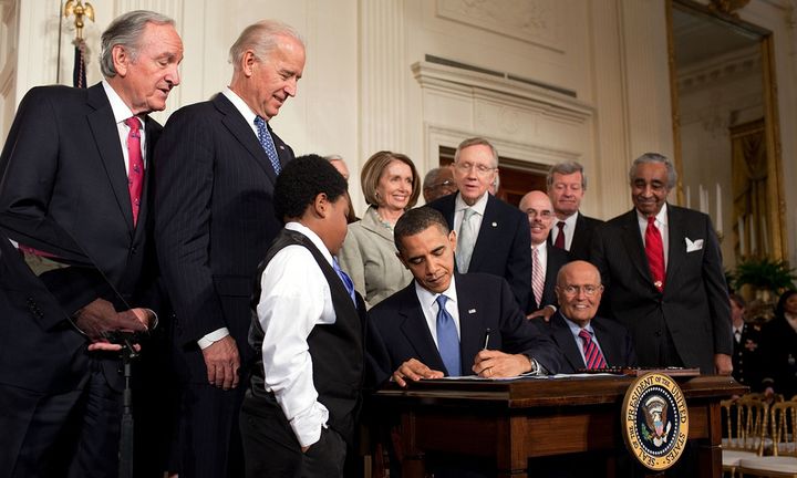 President Obama signs the Patient Protection and Affordable Care Act in 2010. 
