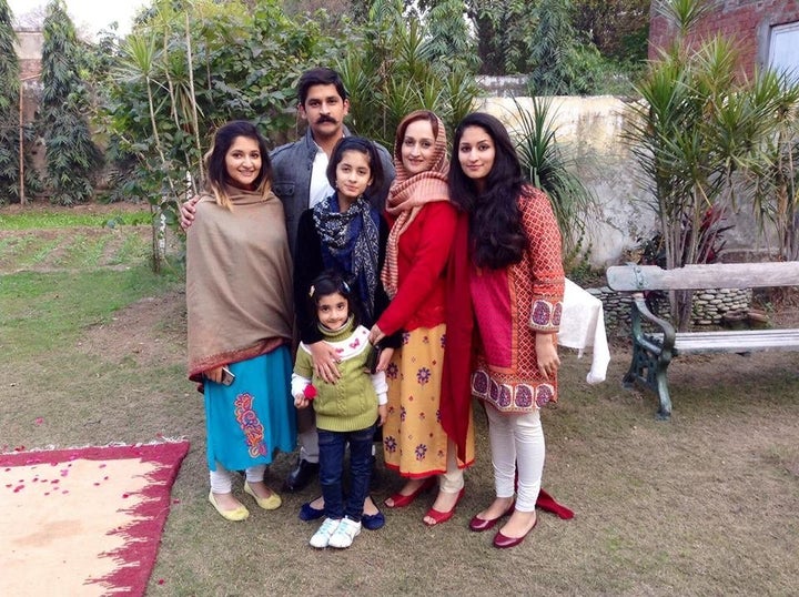 Mahira and her family gather outside their home in Lahore, Pakistan, during Mahira's winter break from university in 2014.