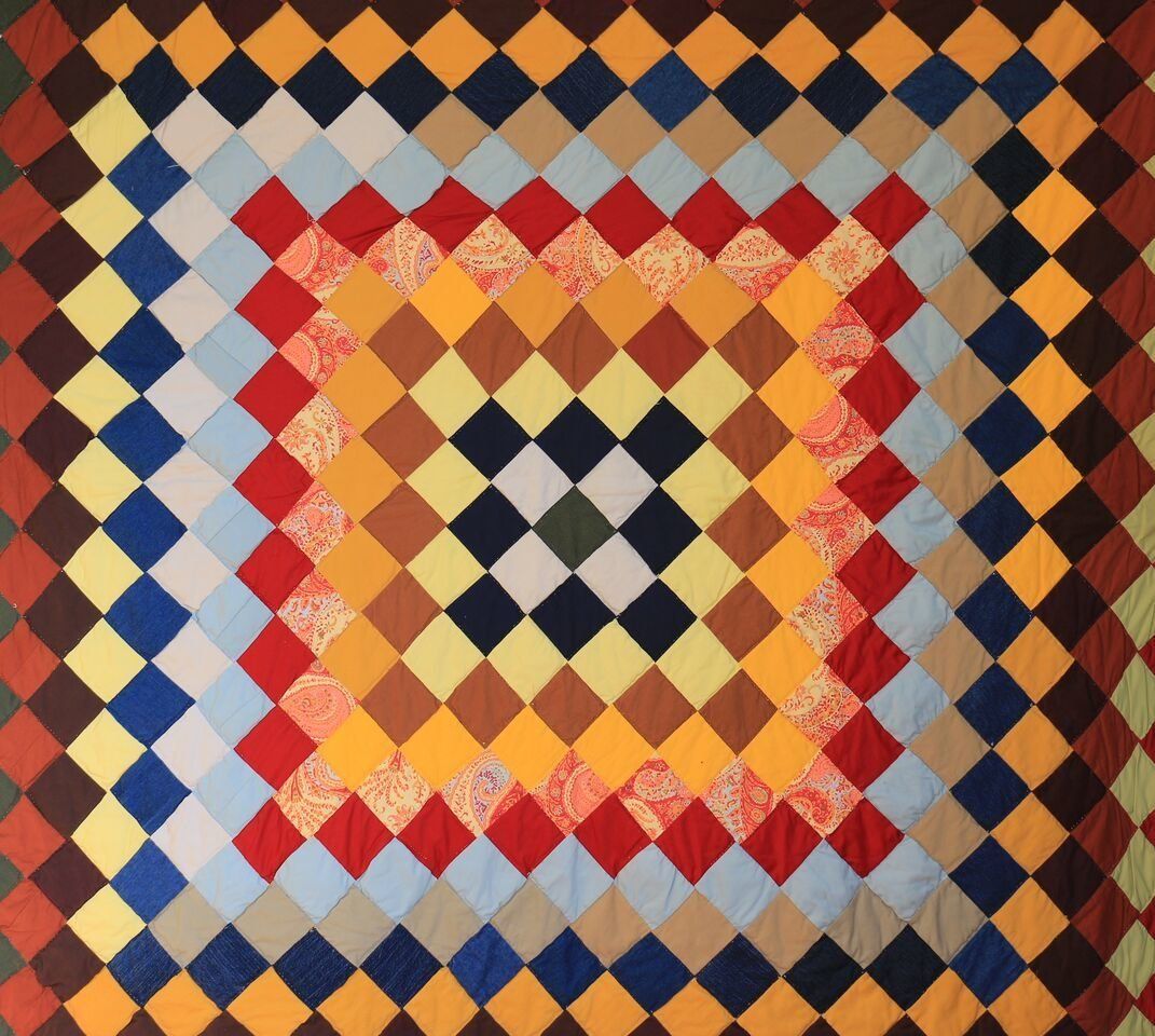 A quilt by Lucy Mingo, c. 1947, that measures roughly 86 by 75 inches.