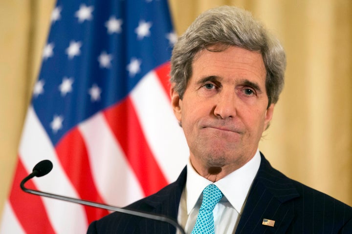 Secretary of State John Kerry takes a question on the peace process at a March 30, 2014 news conference in Paris.