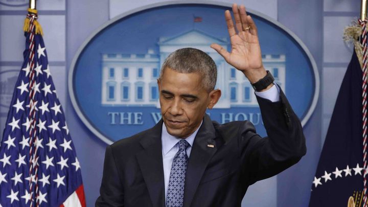 President Obama waves as he concludes his final presidential news conference in the briefing room of the White House on January 18, 2017.