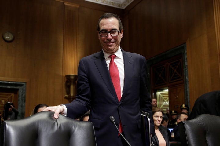 Steven Mnuchin arrives to testify before a Senate Finance Committee.