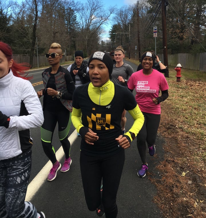 Alison Désir (in yellow) runs part of the 240-mile relay from Harlem New York City, to Washington D.C., that she organized to raise money for Planned Parenthood, January 19, 2017.