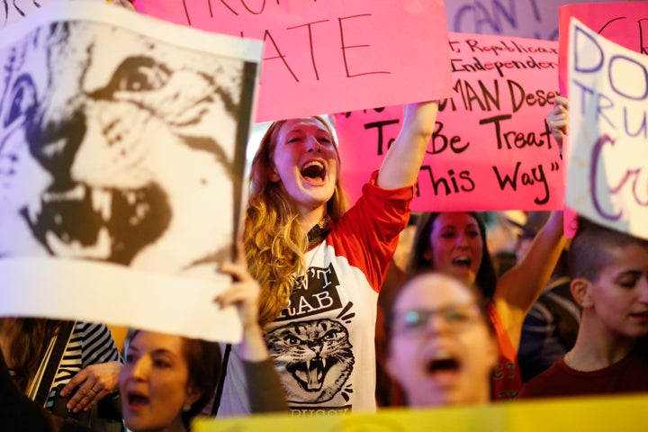 People protest outside the Trump Tower against Donald Trump for his treatment of women in New York on October 19, 2016.