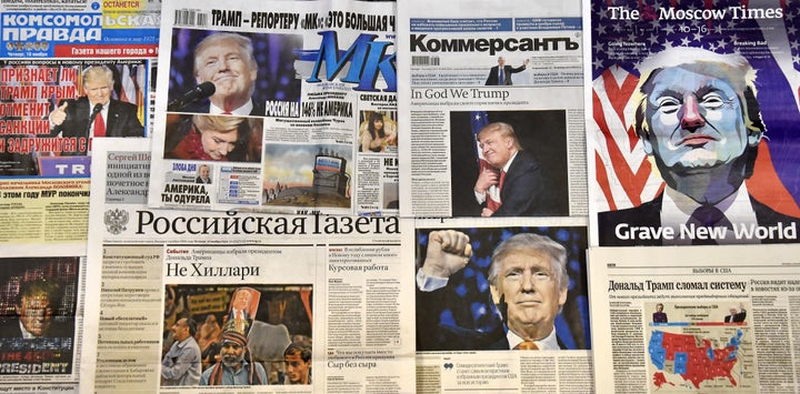 This photo illustration taken in Moscow on November 10, 2016 shows front pages of Russian newspapers reporting on the victory of Donald Trump in the US presidential election.