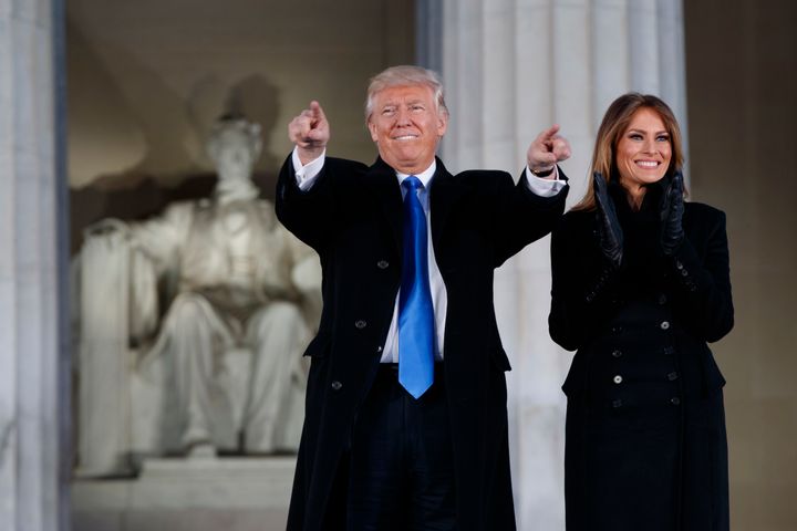 President-elect Donald Trump, left, and his wife Melania Trump arrive to the "Make America Great Again Welcome Concert" at the Lincoln Memorial, Thursday, Jan. 19, 2017, in Washington. (AP Photo/Evan Vucci)