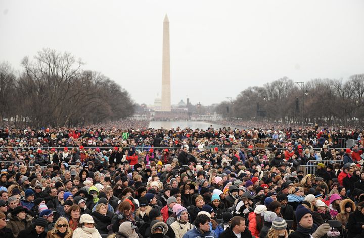 People bundled up against the cold attend the 'We Are One' concert, one of the events of US president-elect Barack Obama's inauguration celebrations, at the Lincoln Memorial in Washington on January 18, 2009.