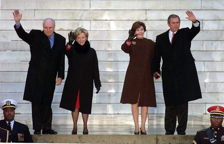 President-elect George W. Bush (R) with his wife Laura and Vice President-elect Dick Cheney and his wife Lynn wave from the steps of the Lincoln Memorial at the start of the inaugural opening ceremonies in Washington January 18, 2001.