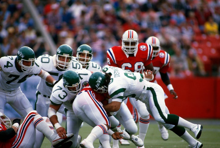 Defensive end Mark Gastineau of the New York Jets looks on as he