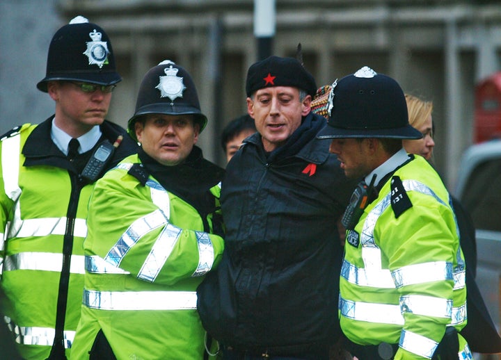 Police officers detain Tatchell after he tried to reach the car of the Indonesian President Susilo Bambang Yudhoyono, during a state visit in 2012.