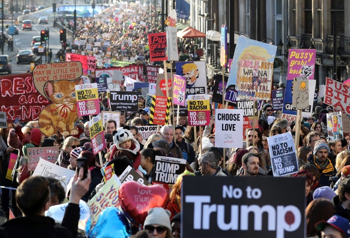 Protesters make their way through the streets of London during the Women's March on Saturday.