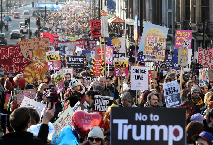 Protesters make their way through the streets of London during the Women's March on Saturday. 