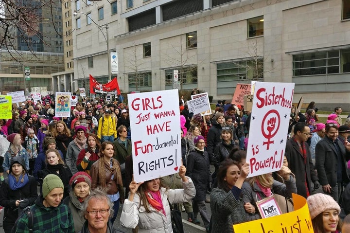 Demonstrators in Toronto make their way to city hall, in a solidarity rally with the Women's March on Washington.