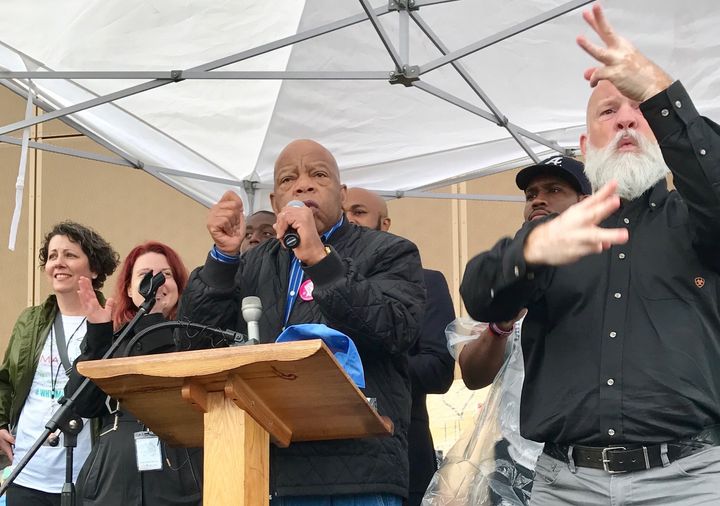 Congressman John Lewis speaks outside The Center for Civil and Human Rights during the Atlanta March for Social Justice and Women on January 21, 2017.