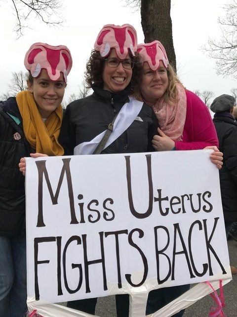 The uterus women got their hats on Etsy. The woman dressed in pink had a “T” shaped IUD in the center of hers!