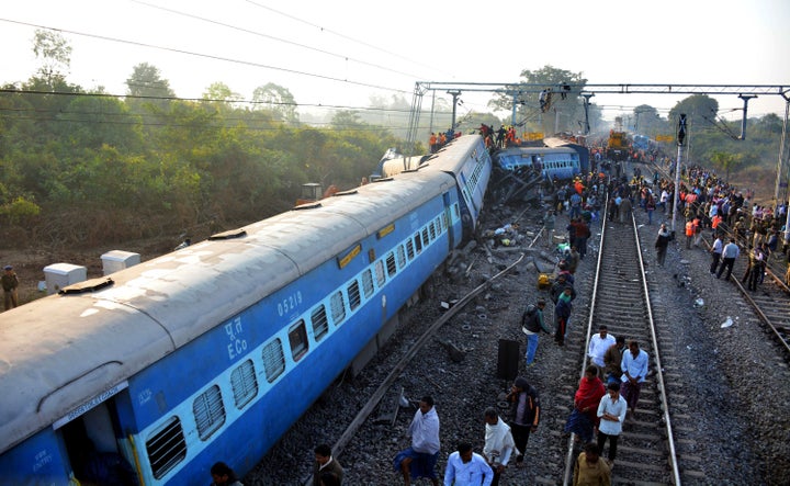 Rescue workers search for victims at the site of the derailment of the Jagdalpur-Bhubaneswar express train near Kuneru station in southern Andhra Pradesh state on January 22, 2017. (STRINGER/AFP/Getty Images)