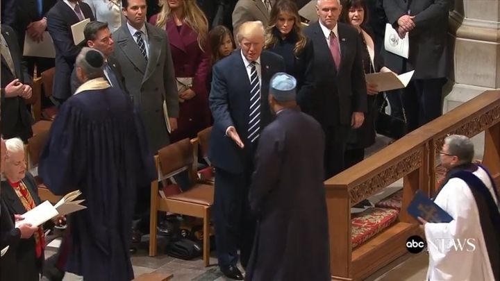 <p>President Trump extending his hand towards Imam Magid at the National Cathedral</p>