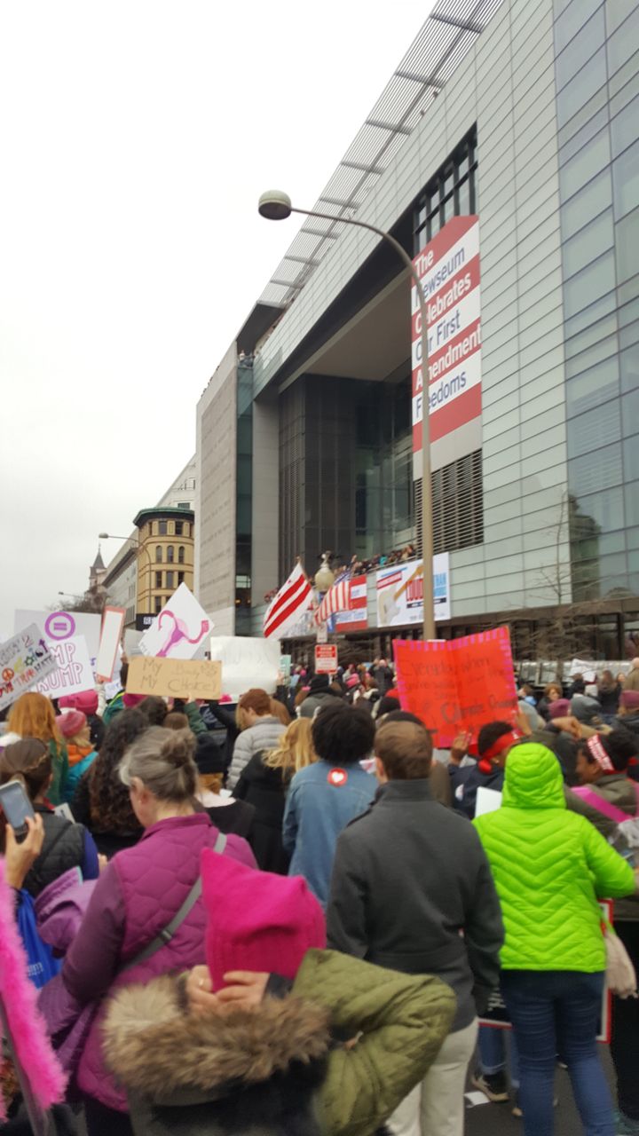 The march passes the Newseum on Pennsylvania Avenue.