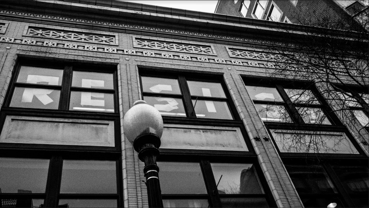 Office building on 8th Street. They put this up as the crowd watched. A cheer went up as they last letter went into place.