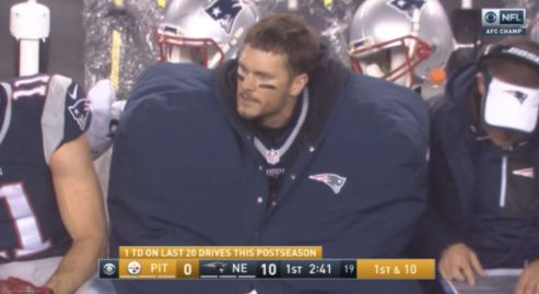 Tom Brady's coat is giant.