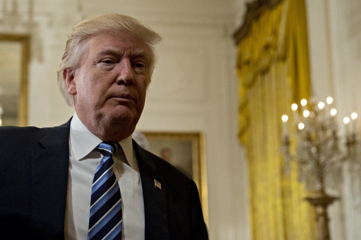 U.S. President Donald Trump walks out during a swearing in ceremony of White House senior staff in the East Room of the White House in Washington, D.C., U.S., on Sunday, Jan. 22, 2017. (Photographer: Andrew Harrer/Bloomberg via Getty Images)