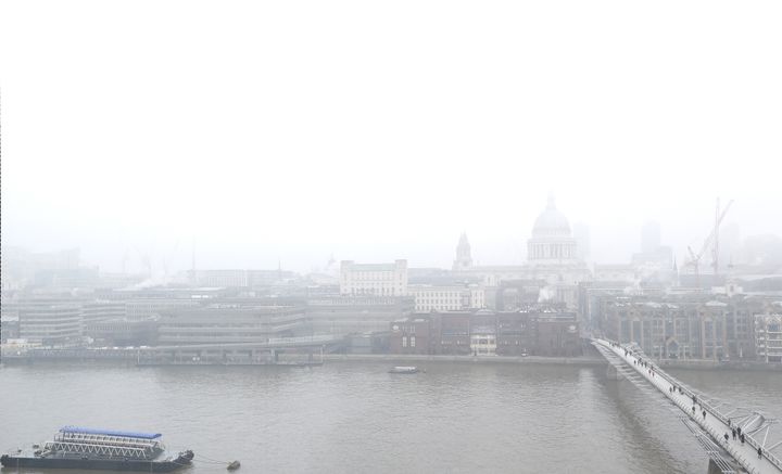 Air pollution is linked to the early deaths of around 40,000 people a year in the UK; pedestrians walk over the Millennium Bridge in London, above