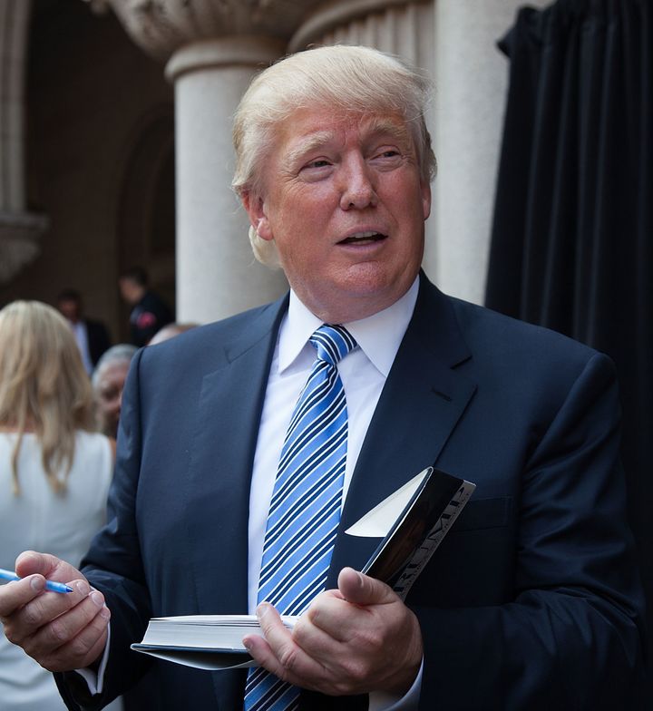 President Trump, pictured with a book in 2014.