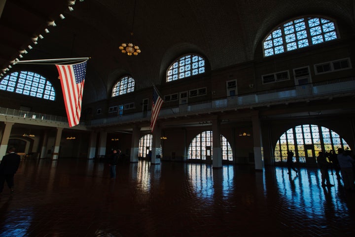 A U.S. flag hangs in the grand hall of the Ellis Island immigration museum building in New York.