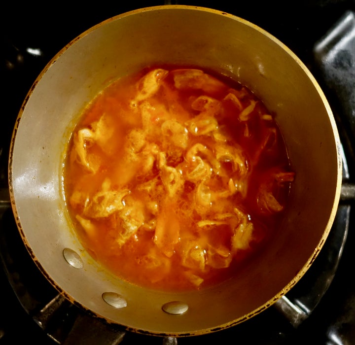 <p>Simmering with white wine, tomato sauce and water</p>