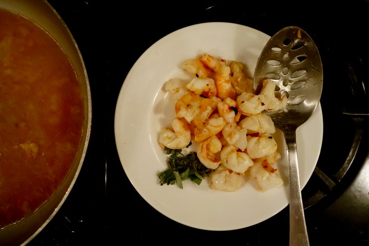 <p>Set the shrimp aside when they are <em>barely</em> cooked (the green on the plate is sage)</p>