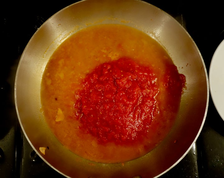 <p>Tomato sauce added to the garlic-and-chili-scented fumet.</p>
