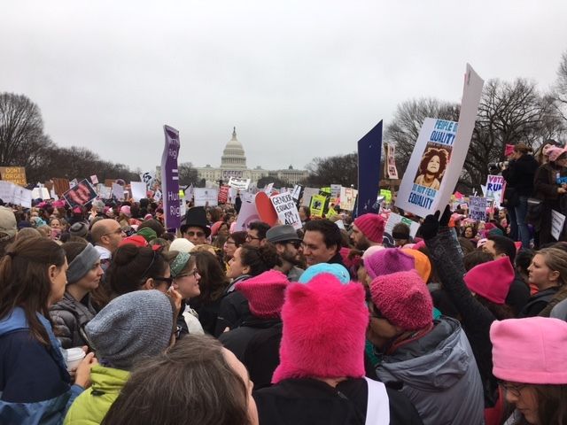 Progressive women and men jam the streets near the US Capitol building.
