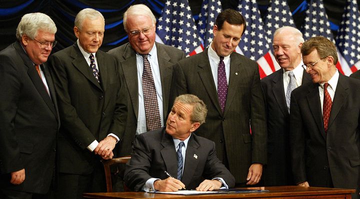 President George W. Bush signed the Partial Birth Abortion Act in 2003, supported by a bunch of male congressmen.