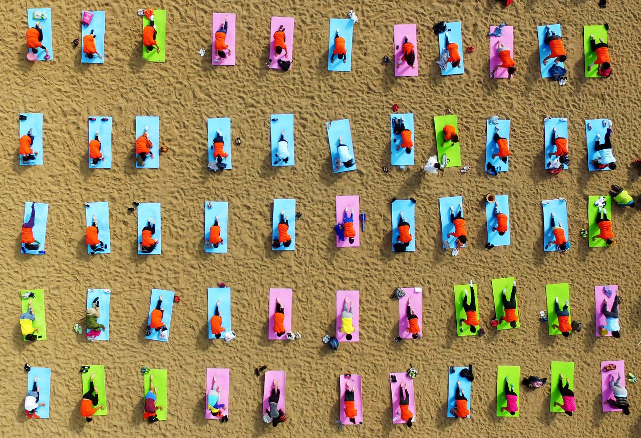 Yoga on the beach in Rizhao. Oct. 6, 2016.