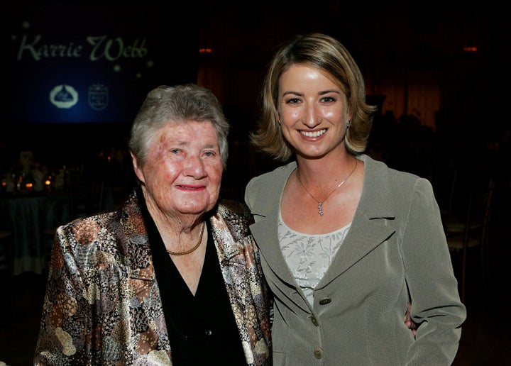 Suggs, at left, poses with Karrie Webb during the LPGA celebration honoring Webb's induction into the 2005 World Golf Hall of