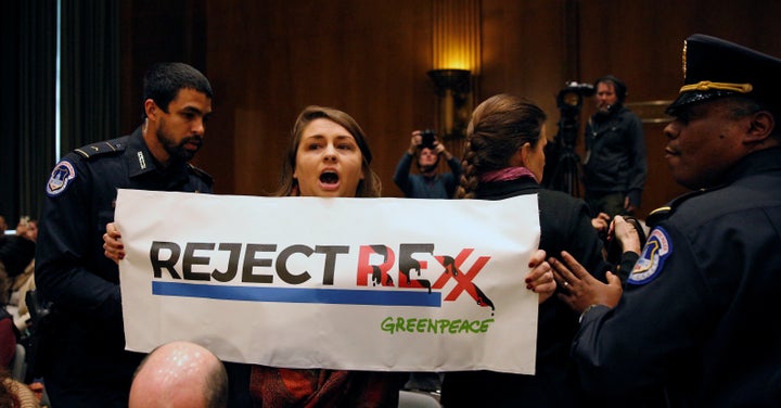 Police remove a protester at the Senate Foreign Relations Committee confirmation hearing for Rex Tillerson, the former chairman and chief executive officer of Exxon Mobil, on Capitol Hill in Washington, U.S. January 11, 2017.