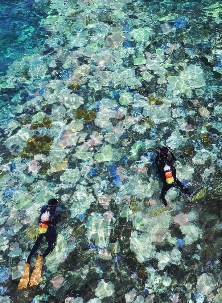 This Sept. 12, 2016 photo, captured from a drone, shows Japan's largest coral reef, Sekiseishoko, between Ishigaki and Iriomote islands in the southernmost prefecture of Okinawa.