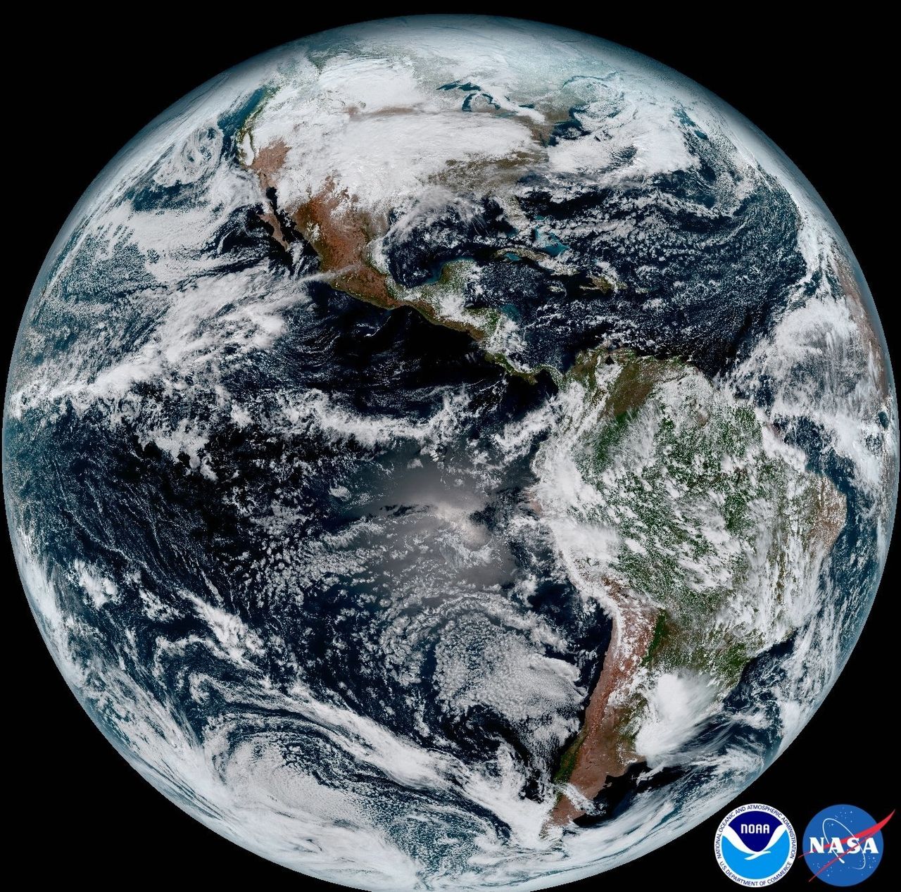 This composite color full-disk visible image was created using several of the 16 spectral channels available on the GOES-16 Advanced Baseline Imager (ABI) instrument. The image shows North and South America and the surrounding oceans.