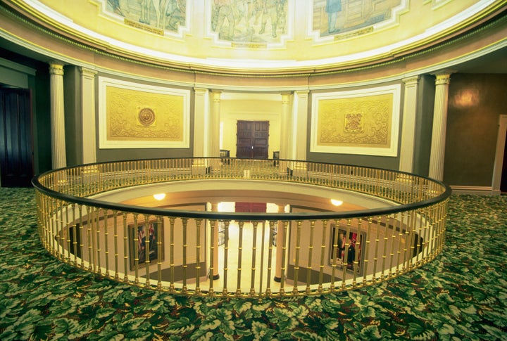 The open mezzanine of the Alabama State Capitol building allows visitors to view the rotunda murals from the floor below. Montgomery, Alabama.