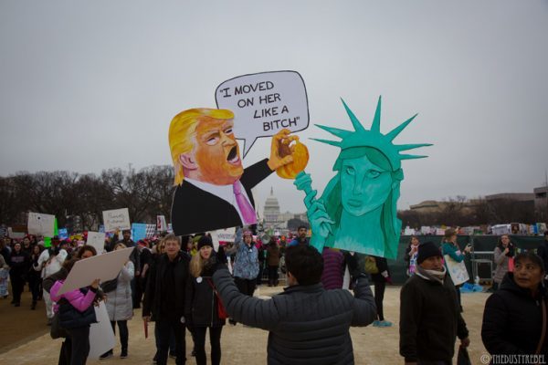 Using a Trump quote from a video tape released in October, this sign features the Statue of Liberty. 