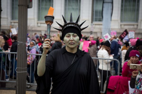 Here the Statue of Liberty is portrayed as silenced. 