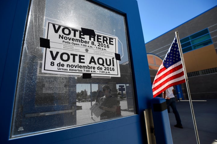 A multi-language sign directs people to a polling station during voting in the 2016 presidential election. 