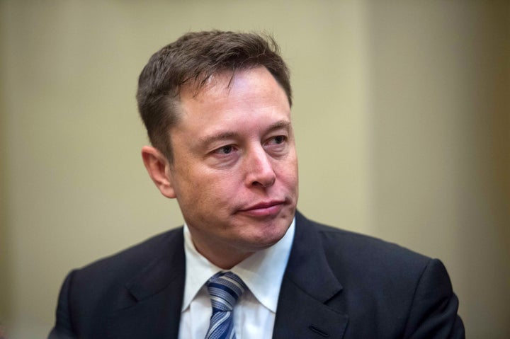 Elon Musk listens to President Donald Trump speaks during a meeting with business leaders in the Roosevelt Room at the White House in Washington, DC, on January 23, 2017.